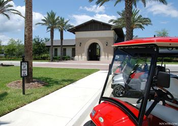 Golf cart parking area with clubhouse entrance